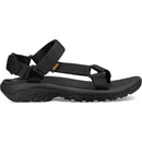 Black sandal with a strap on a white background