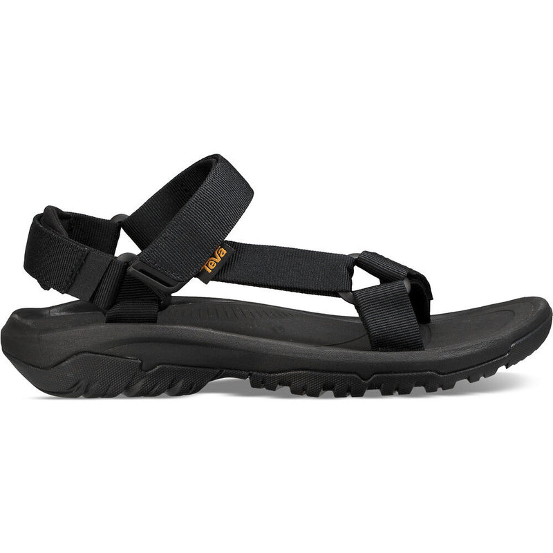 Black sandal with a strap on a white background