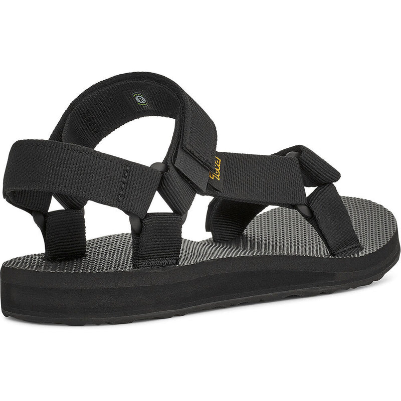 Black sandal with multiple straps on a white background