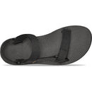 Black sandal with a strap on a white background