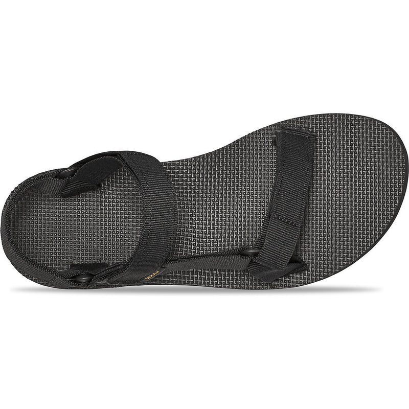 Black sandal with a strap on a white background