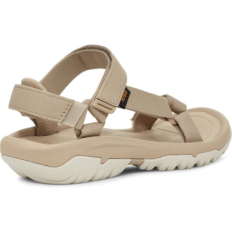 Beige sandal with multiple straps on a white background