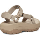 Beige sandal with multiple straps on a white background