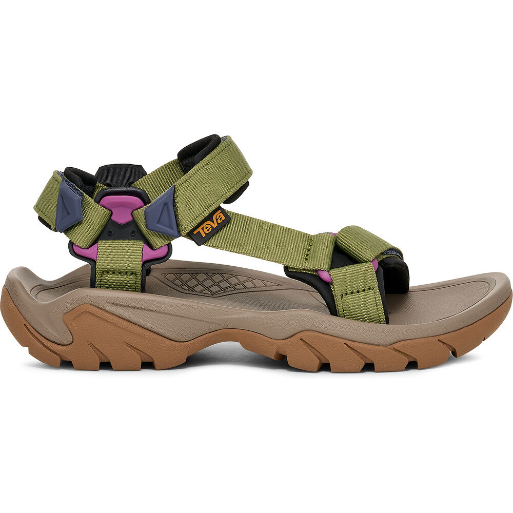 Teva sandal with green straps and brown sole on a white background