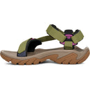 Green and brown sandal with multiple straps on a white background