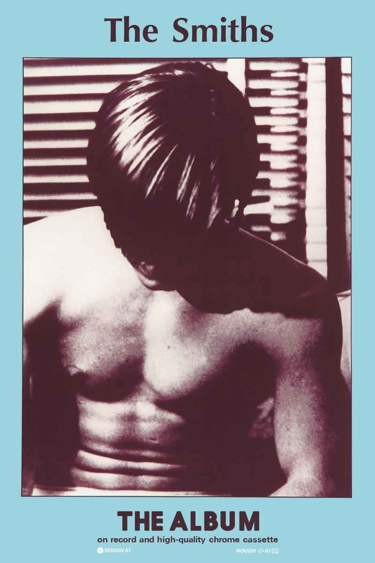 A poster depicting a monochrome image of a person with their back turned, looking towards their shoulder, with the text 'The Smiths' and 'The Album' indicating it is related to the band's first album.