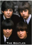 Four members of The Beatles with their distinctive hairstyles and formal attire.