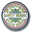 Circular badge with 'St. Pepper's Lonely Hearts Club Band' text and decorative elements on a white background