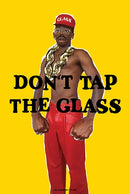 Person wearing a red cap and gold chain with text 'DON'T TAP THE GLASS' on a yellow background