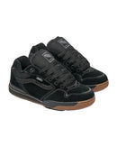 Black sneakers with brown soles on a light gray background