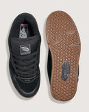 Black sneaker with brown sole on a white background