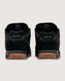 Black sneakers with brown soles on a white background