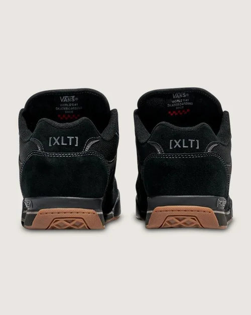 Black sneakers with brown soles on a white background