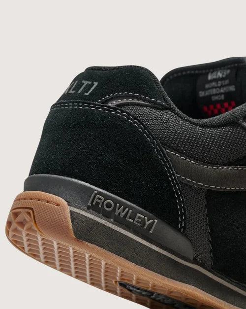 Black sneaker with 'Rowley' branding on a light gray background