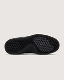 Black sole with textured sole on a light gray background
