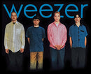 Four band members standing together with 'weezer' logo above them