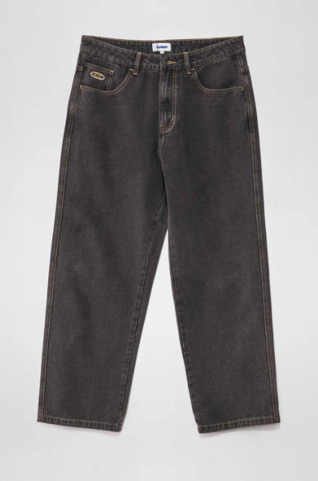 Pair of dark gray jeans on a white background