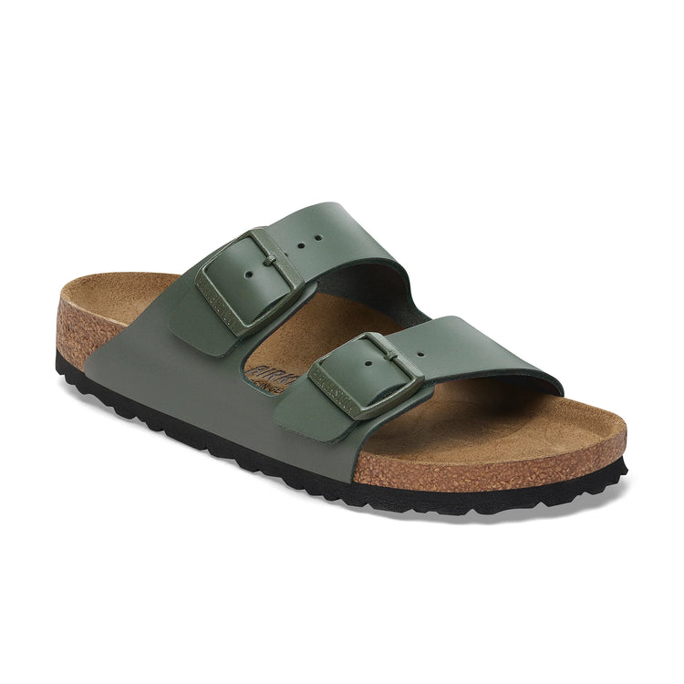Green sandal with cork sole on a white background