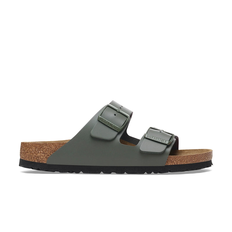 Green sandal with cork sole on a white background