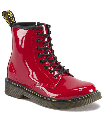 A red patent leather youth boot with a lace-up closure and a brand tag attached to it.