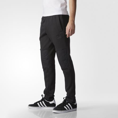 Adidas Originals Quilted Track Pant Black AJ7883 Quilted panels bring a basketball-inspired look to an essential street style.  Famous Rock Shop. 517 Hunter Street Newcastle, 2300 NSW Australia