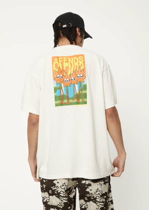 The image features the Afends Vibrations Hemp Boxy T-Shirt in an off-white color. The t-shirt has a relaxed, boxy fit with a ribbed neckline and a small front logo.