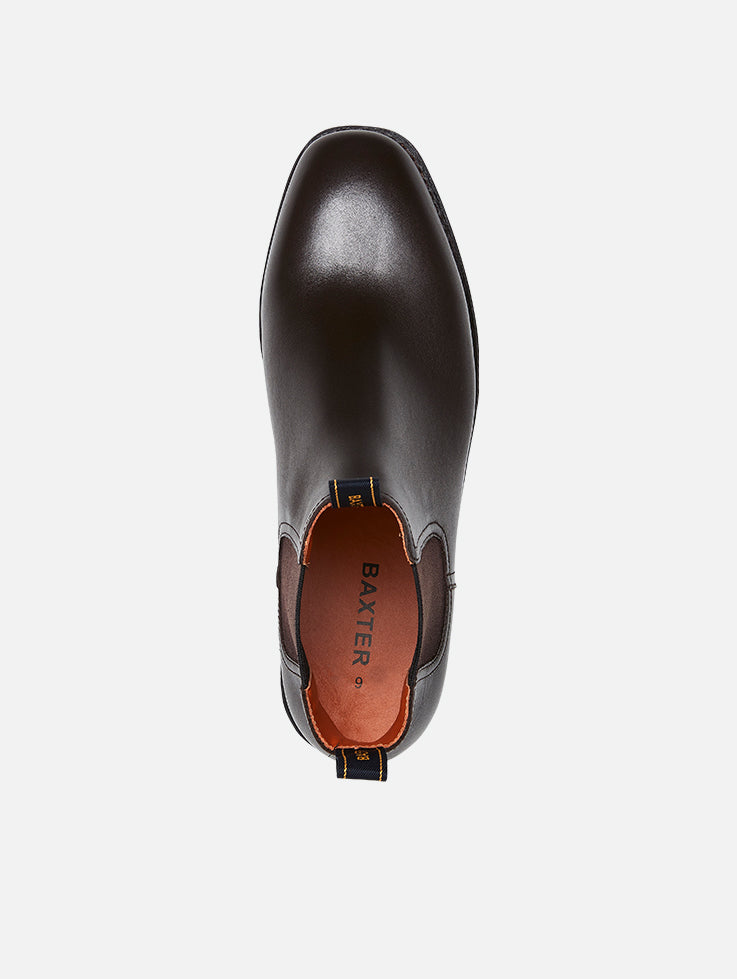 A pair of Baxter Drover walnut leather boots with elastic side panels on a white background.