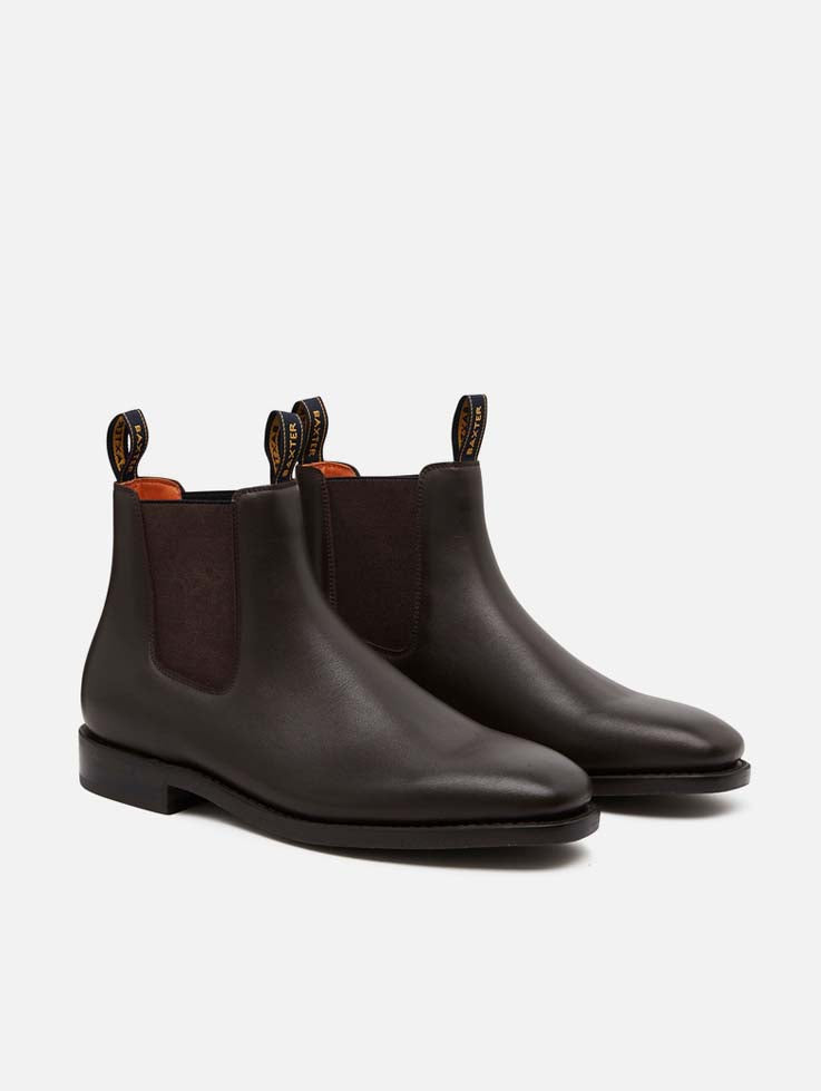A pair of Baxter Goulburn brown leather boots on a white background.
