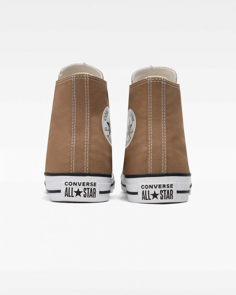 A pair of Converse Chuck Taylor All Star high-top sneakers in sand dune brown color.