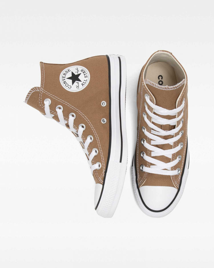 A pair of Converse Chuck Taylor All Star high-top sneakers in sand dune brown color.