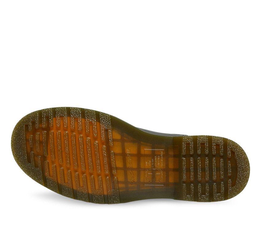 A pair of Dr Martens 2976 Black Nappa Leather Chelsea Boots with yellow welt stitching and the brand's logo visible.