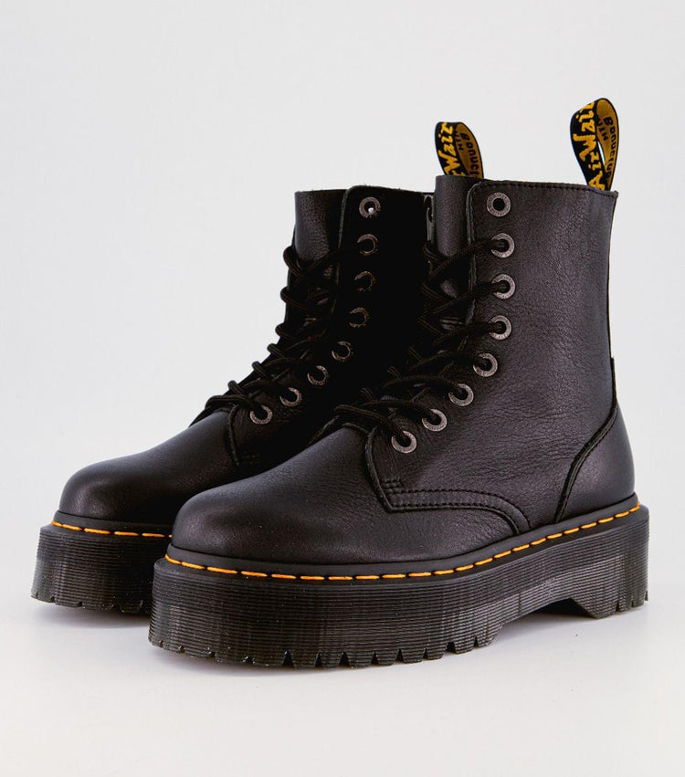 A pair of Dr Martens Jadon III Black Pisa Leather boots with yellow stitching and black laces on a white background.