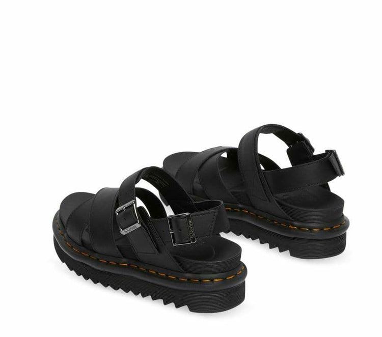 A pair of Dr Martens Voss II Black Hydro Leather Sandals with gunmetal buckles on a white background.