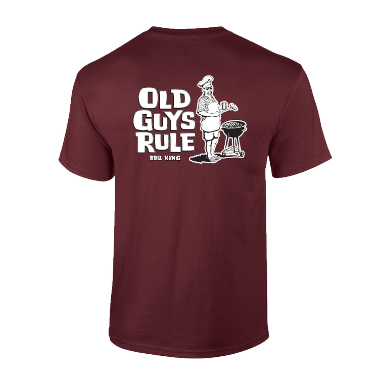 A maroon men's t-shirt with the text 'OLD GUYS RULE BBQ KING' printed on the front and the logo 'OGR' above the text.