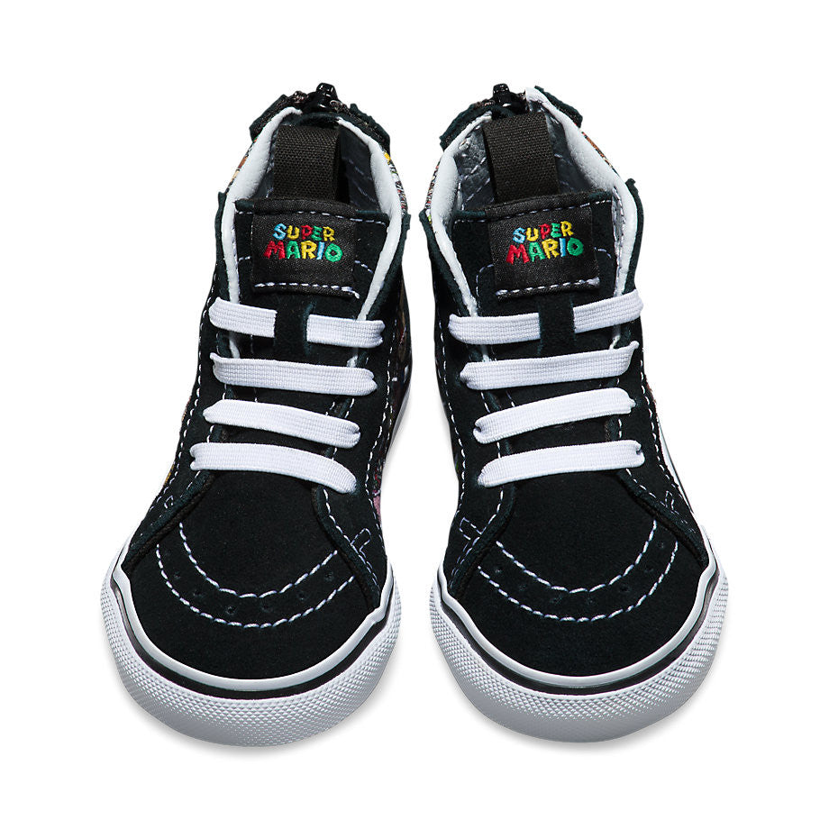 A pair of Vans SK8-Hi Zip sneakers with a limited edition Nintendo Mario & Luigi design, predominantly black with colorful character graphics.